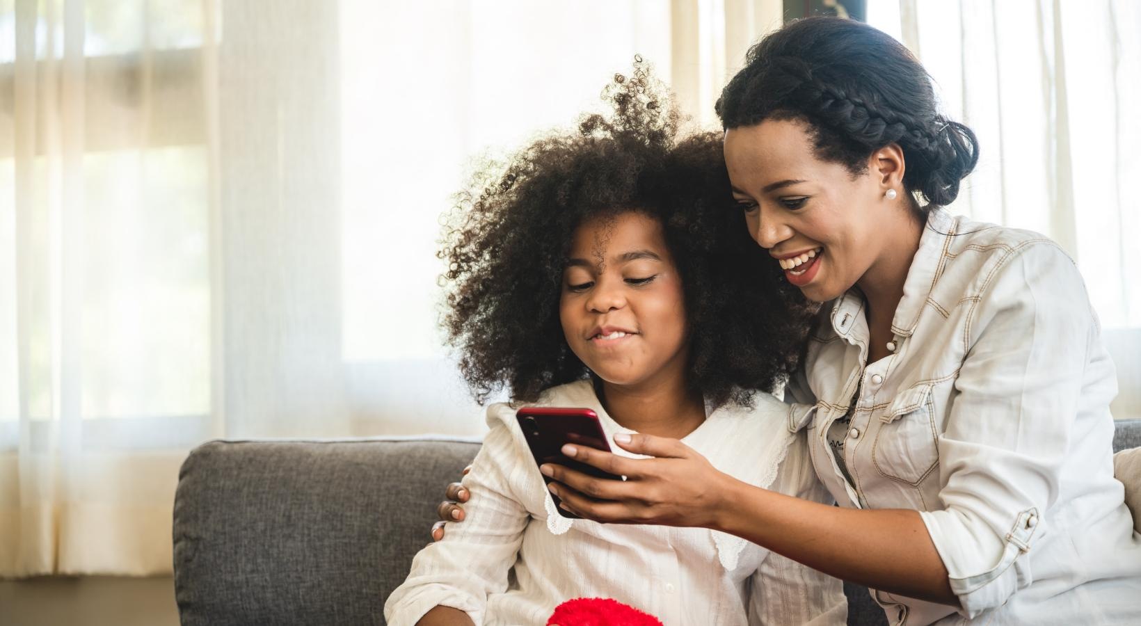 Find your perfect fit at The Mordecai on Clover a woman and a child looking at a phone