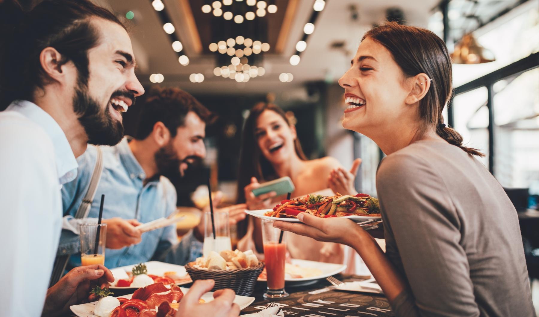 Vibrant community life with a variety of dining options a group of people eating in a restaurant