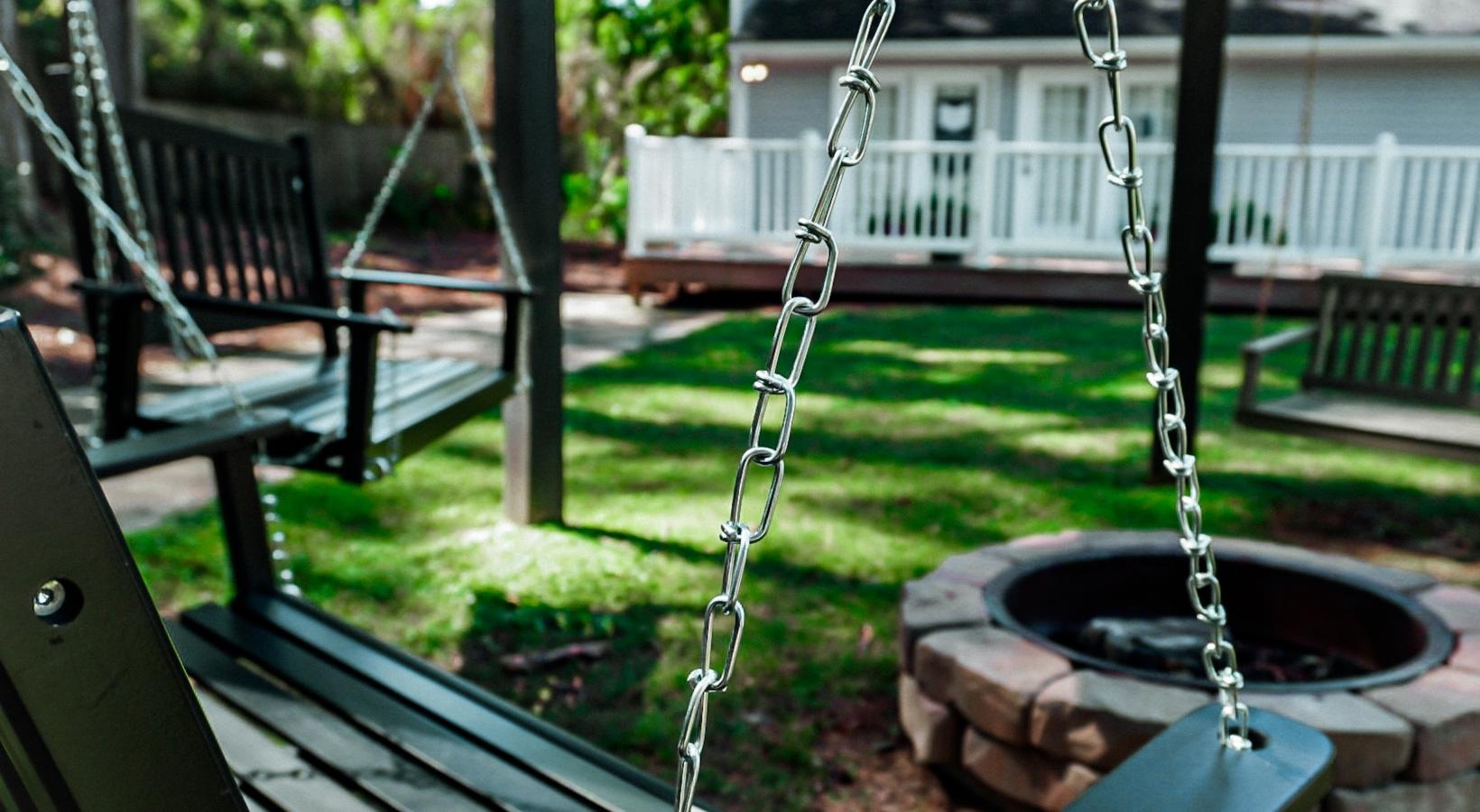 Settle into comfort at The Mordecai on Clover a fire pit and a swing