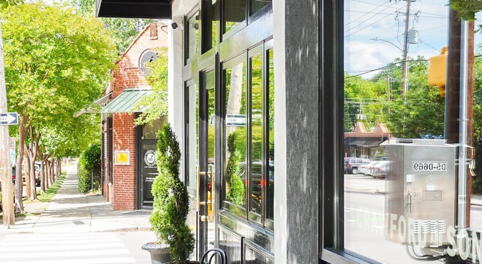 The essence of exceptional living a table and chairs outside a building